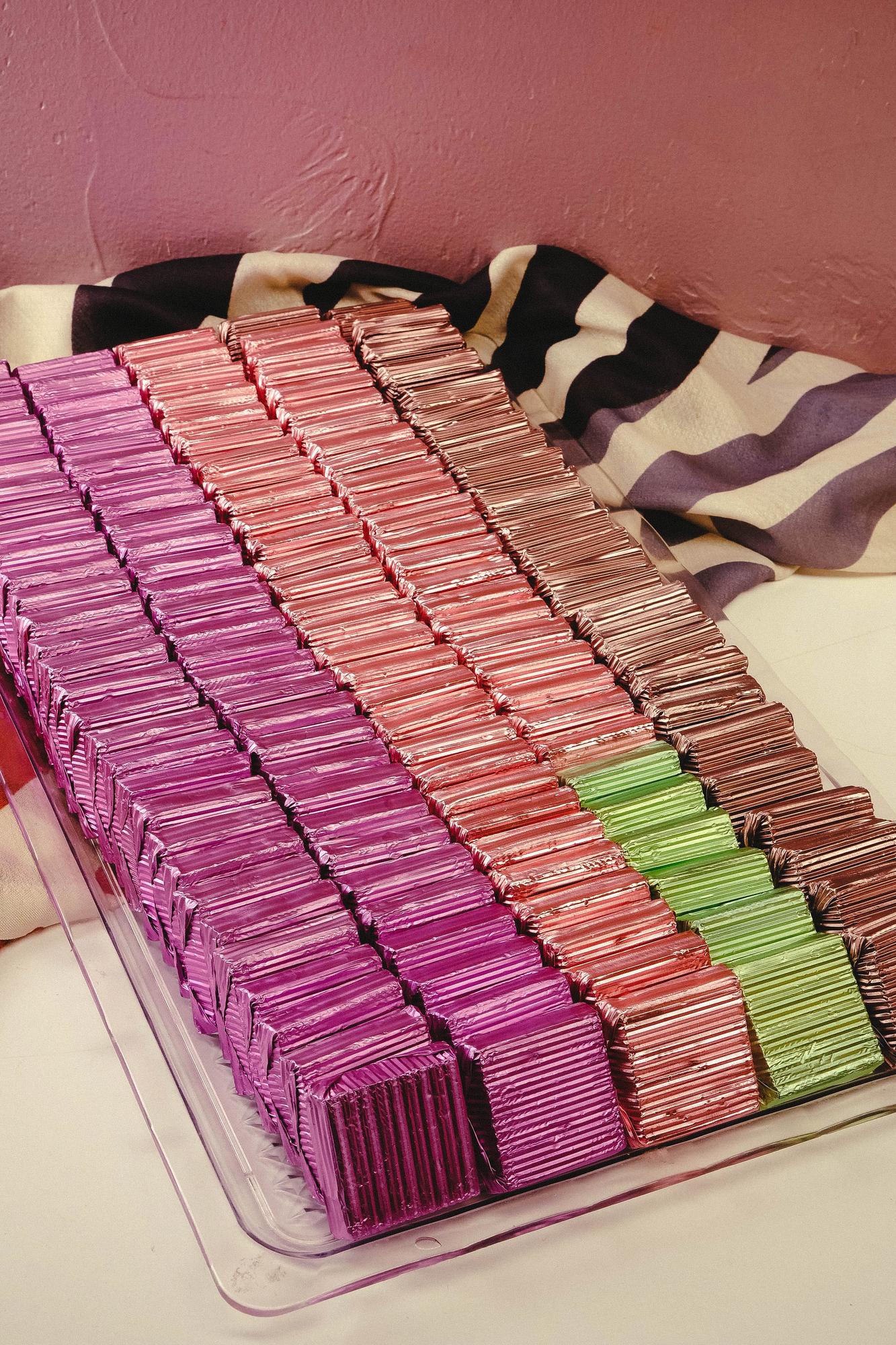 Stack of embroidered samples and color swatches